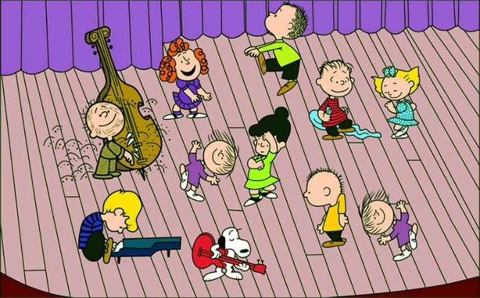 Peanuts gang dancing on the stage during the A Charlie Brown Christmas rehearsal scene