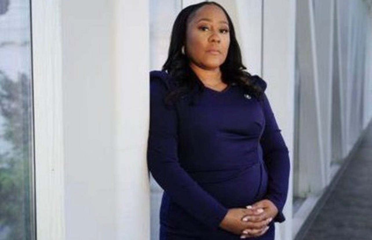 fani willis in pink dress Fani Willis denies having sexual relationship with special prosecutor Nathan Wade