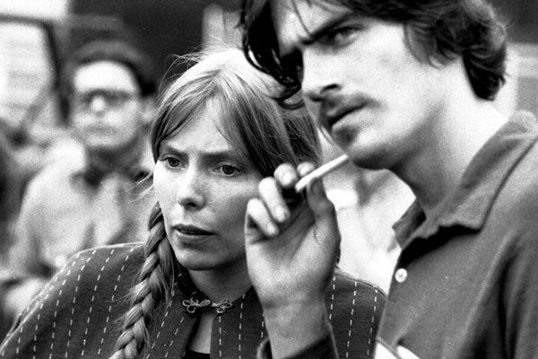 As Joni Mitchell became a radical, James Taylor just stayed