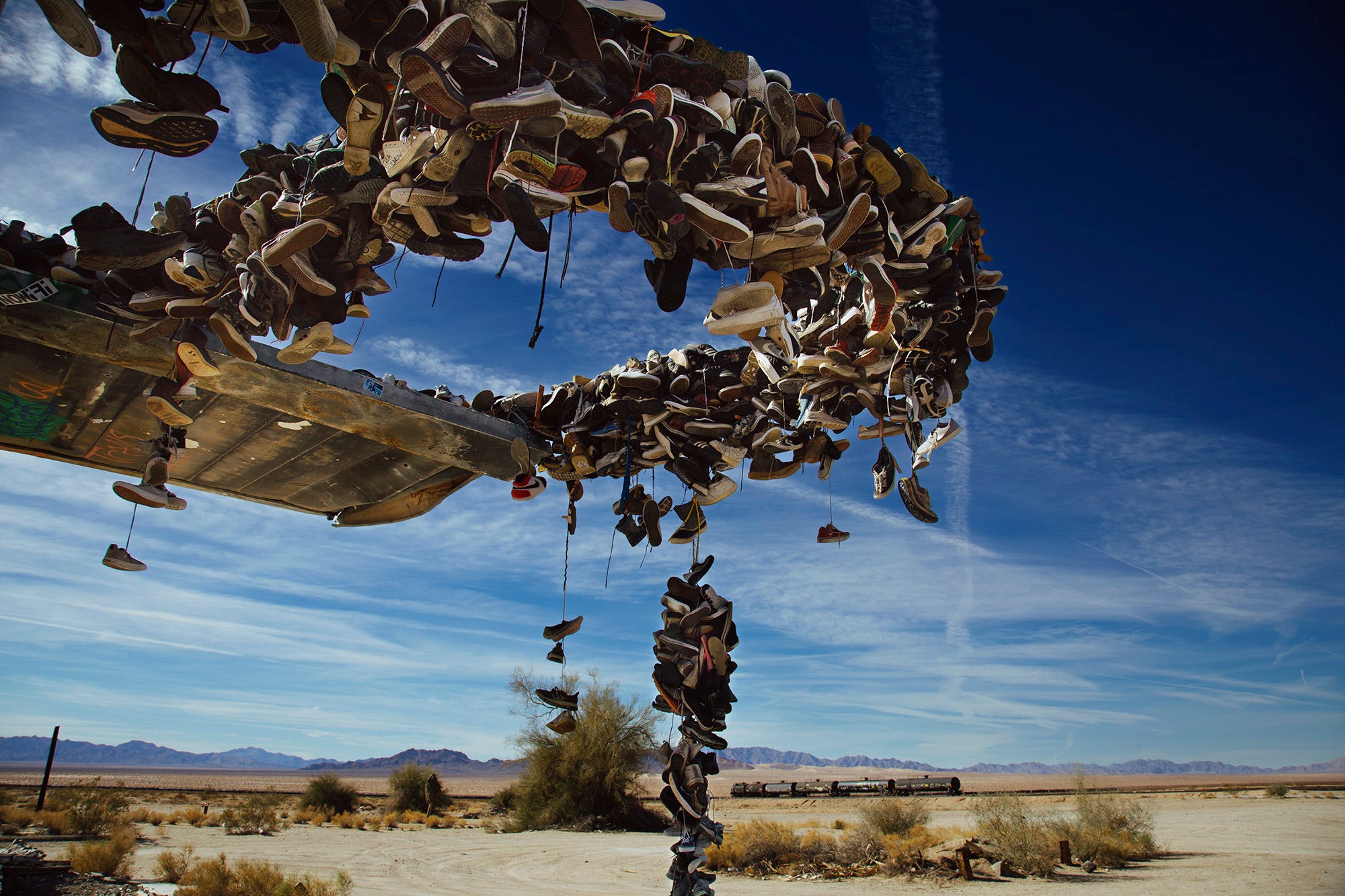 Aぇ! group Runway 木 Walking Away: A Monument of Abandoned Footwear in the Mojave | by