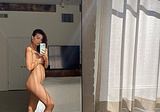 Emily Ratajkowski Wears Nothing But Socks and Gold Hoops in a Nude Mirror Selfie