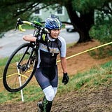 Girl on green bike