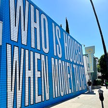 Barbara Kruger Mural in LA Asks, ‘Who Is Housed When Money Talks?’