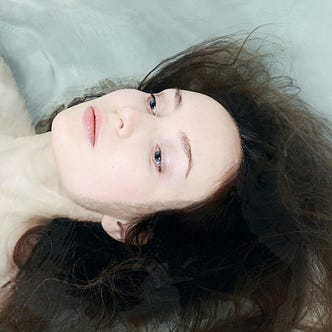 woman laying in water