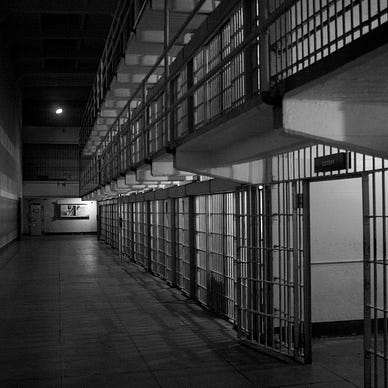 Black and white photo of prison cells
