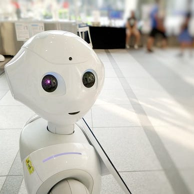 A white robot with black eyes