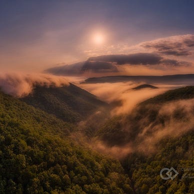 Hazy sky over mountain tops