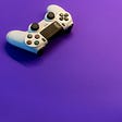 a white gaming controller on a purple background