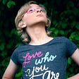 Girl wearing T-Shirt that says, “Love who you are.”