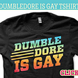 A black T-Shirt with the words “Dumbledore Is Gay” in bright colors