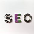 Three letters spelling SEO with patterns and designs.