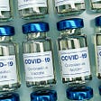 Multiple small Covid-19 vaccine bottle.