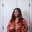 Free People Harper Jumpsuit | Easy Mocktail Recipe by popular D.C. lifestyle blogger, Alicia Tenise: image of Alicia Tenise wearing a Free People Harper Jumpsuit and holding a clear glass filled with a mocktail.