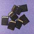 A stock photo of a handful of memory cards.