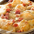 Potatoes with bacon and gratin with bechamel sauce.  Easy recipe step by step