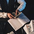 Accountant counting business cash flow