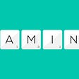 On a green background, we can see six scrabble tiles lined up together forming the word "naming".