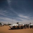 Peacekeepers from the Nigerian contingent of MINUSMA provide security on an airstrip during the arrival of a U.N. fact-finding mission in Mali.