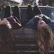 Young Women Sharing and Laughing on Car Hood Image by Free-Photos from Pixabay