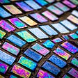 wavy lines of multicolored glass mosaic tiles.