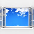 open window to blue sky with clouds