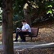 Missionaries sitting on park bench