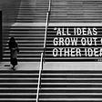The quote “All ideas grow out of other ideas” is written across steps. A person walks on the other side of the staircase.