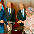 Two UN officials and two World Economic Forum officials during the deal signing