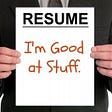 Person holding a resume that says I am good at stuff