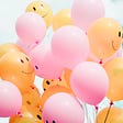 Happy brain chemicals, dopamine, serotonin, oxytocin, endorphins. A picture of happy balloons.