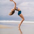 woman dancing on the beach