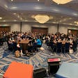 Ballroom with 400 attendees participating in the Panel for Mental Health at Grace Hopper Celebration.