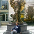 Faith poses with the Recording Angel Statute at entrance to the Schermerhorn Symphony Center Nashville.