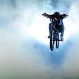 Man on bike soaring through the air