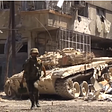 A soldier in front of a Tank during the Syrian Civil War