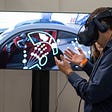 Man using a virtual reality headset, viewing a virtual interface.