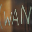 hand painted sign with the word WANT