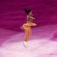 Figure skater performing a technical requirement for competition