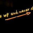 Image of a sign that says, “Go up and never stop.”