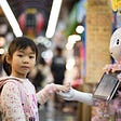pic of young girl and a robot