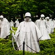 Statues of soldiers with riffles.