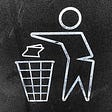 a chalkboard drawing of a person throwing something in the trash can