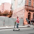 People riding electric scooters in Prague