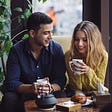 Guy and girl having coffee