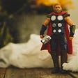 Thor action figure with hammer and cape