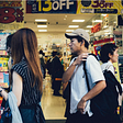 People shopping in an asian country. Photo by Andrew Leu on Unsplash