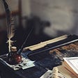 Picture of a quill on a desk