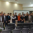Group of people posing for a photograph after a seminar