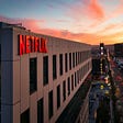 The Netflix sign sits atop a building in Hollywood, California