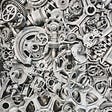 Multiple white and silver cogwheel and machine parts.